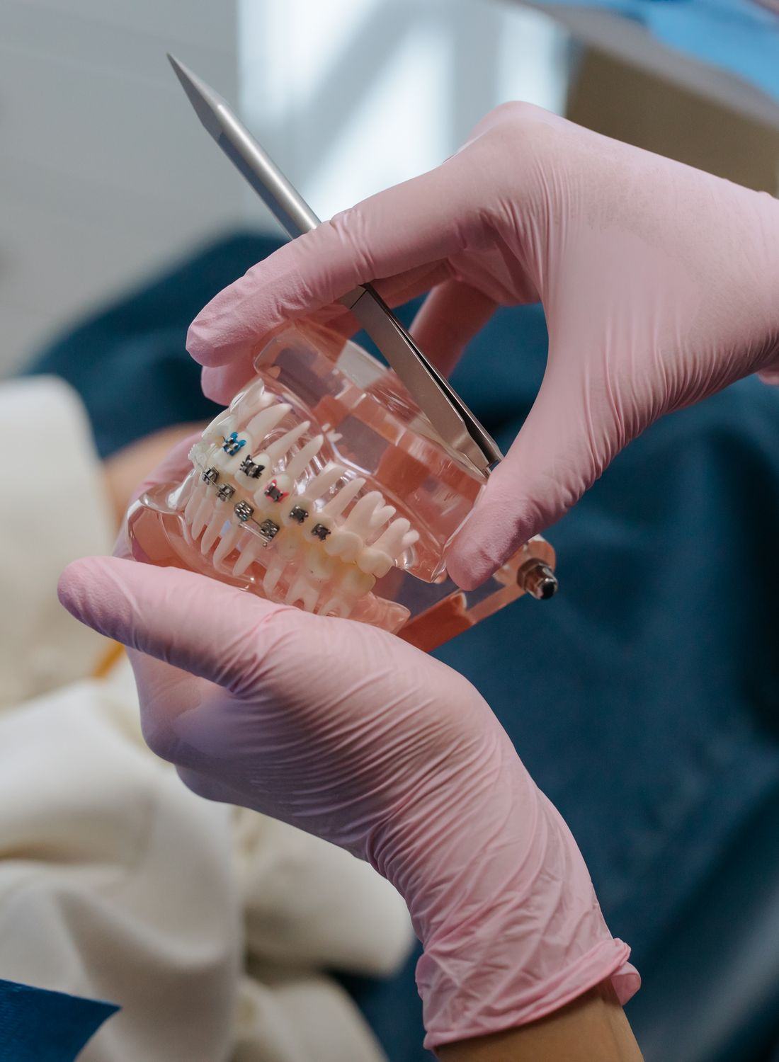 Orthodontic appliance held by a clinician